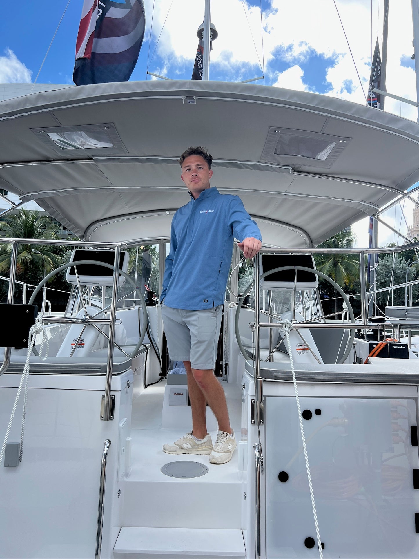 Guy wearing Ogio Half Zip Pullover - Black - Catalina Yachts Logo