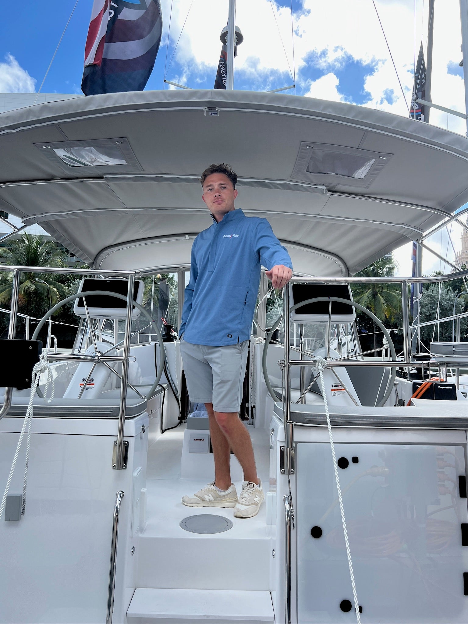 Guy wearing Ogio Half Zip Pullover - Black - Catalina Yachts Logo